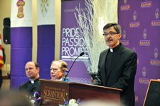 The Reverend Kevin P. Quinn, S.J., J.D., Ph.D., executive director of the Ignatian Center for Jesuit Education and a professor of law at Santa Clara University, Santa Clara, Calif., was named the 25th president of The University of Scranton at a news conference on Wednesday, Dec. 15, 2010. Pictured to the left of Father Quinn (at podium) are University of Scranton President Rev. Scott R. Pilarz, S.J., and Christopher “Kip” Condron, chair of the University’s Board of Trustees. Father Quinn will assume his duties as president on July 1, 2011. 